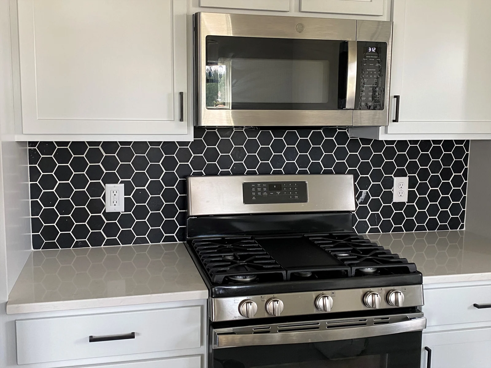Eurostar kitchen remodeling photo showing a range and surrounding cabinetry